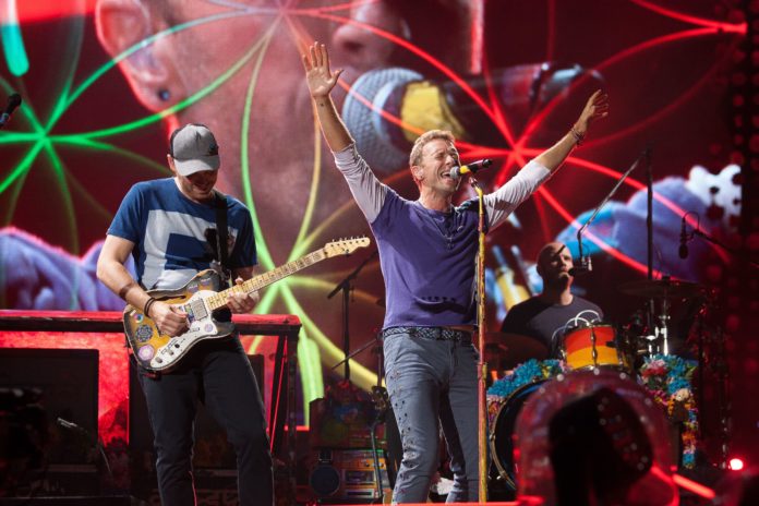Jonny Buckland and Chris Martin Coldplay in concert at Rogers Theater in Toronto, Canada in 2017.